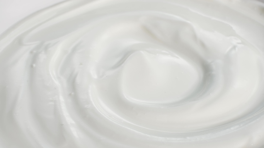 Rotating bowl of sour cream or greek yogurt, closeup | Shutterstock HD Video #1046112424