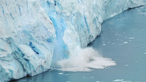 Global Climate changes awareness video - the glaciers are warming and melting faster.  The glacier gives the lake Argentino huge blocks of ice. Ice detaches and falls into the Icebergs Channel.