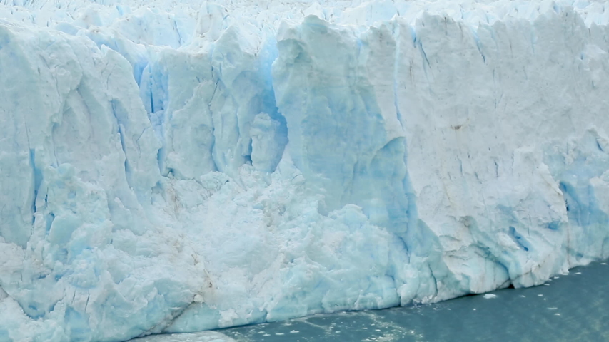 Global Climate change footage: nature is declining, and glaciers are melting. Climate awareness and warming video. The Perito Moreno glacier in Los Glaciares National Park collapses into a large lake. | Shutterstock HD Video #1046113540