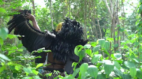 Prehispanic mexican characters in the jungle. (Mayan/Aztec) Slow motion.