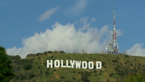 Hollywood Sign in Los Angeles, Close up Famous landmark California thru green plants unique view LOS ANGELES USA 23.12.2019