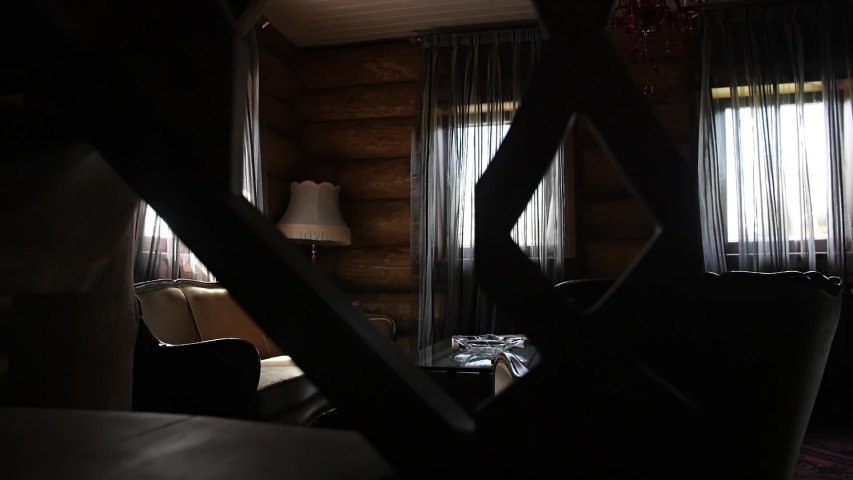 Wooden house. Rural wooden house. Village home. Wooden walls. Wood building. Windows in house. Morning hall house. Dark room. Mysterious room. Interior desing. Furniture design. Empty room. Building. 