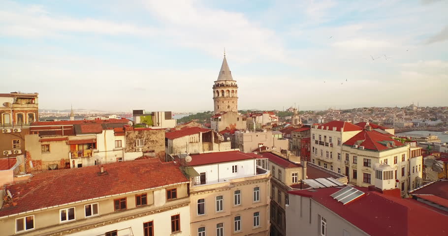 4k footage of Bosporus in the sun set having Galata tower in the middle.  Camera rotates around the Galata tower. Royalty-Free Stock Footage #10461470
