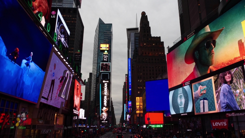 NEW YORK CITY, USA - NOV 20, 2019: Moving drone pov shot of busy street next to Time Square at night in Manhattan. NYC is American tourism destination, iconic landmark in USA. 4k slow motion.   