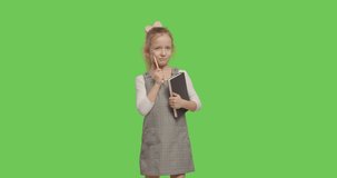 young businesswoman child thinking of idea and holding notebook. girl worried about something on Green Screen. 4k raw video footage slow motion 60 fps
