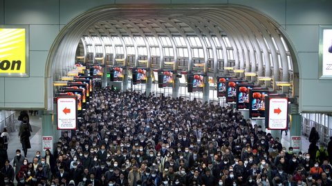 Tokyo, Japan-04 February, 2020: 4K, Overhead Japaneses travellers wear mask at Shinagawa Station to prevent infection coronavirus. The virus has caused emergency situation during Chinese New Year.