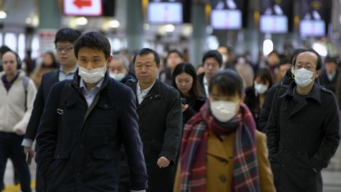 Tokyo, Japan-04 February, 2020: 4K, Japanese business men and women wear face masks. People wearing the mask at the Shinagawa Station as precautionary measures during coronavirus from Wuhan, China