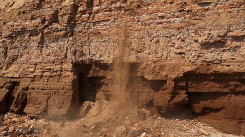 Clay precipitates. Rockfall. Landslide from the tour. Sunny summer day