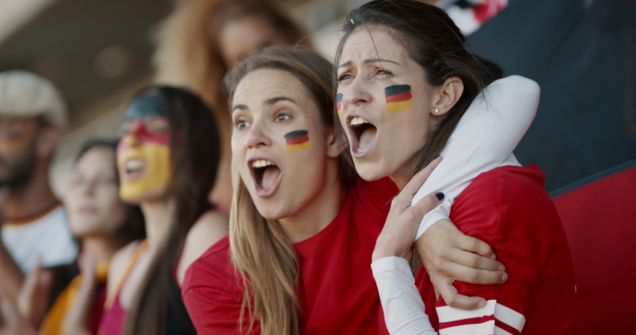 German spectators in stadium cheering together. People from Germany in fan zone cheering for their national team. Royalty-Free Stock Footage #1046194168