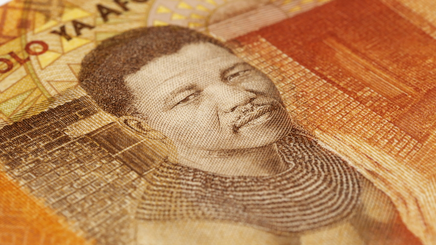 Young Nelson Mandela portrait on South Africa 20 rand note rotating. Low angle, macro. 4K, 422 10 bit