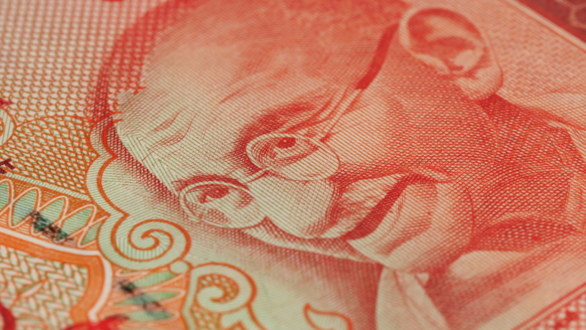 Mahatma Gandhi portrait on India 20 rupee banknote rotating. Low angle, macro. 4K, 422 10 bit
