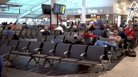 London / United Kingdom (UK) - 11 10 2019: People waiting for flights in airport waiting hall. International travel destination for tourists at London Luton airport.