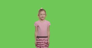 Girl closes her ears with her hands isolated on Green Screen, Emotional ghild on chroma Key. 4k raw video footage slow motion 60 fps