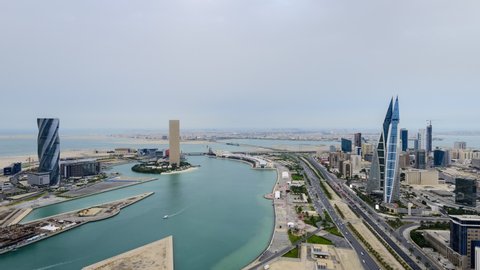 MANAMA , BAHRAIN - FEBRUARY 10, 2020: 4K Aerial time lapse of Bahrain's tallest iconic buildings at Bahrain Bay and World trade center with moving traffic, Manama, Bahrain on February 10, 2020.