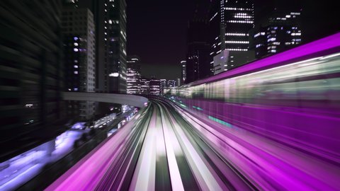Hyper time-lapse of a Train moving through a futuristic neon city. Cyberpunk theme. Seamless Looping.