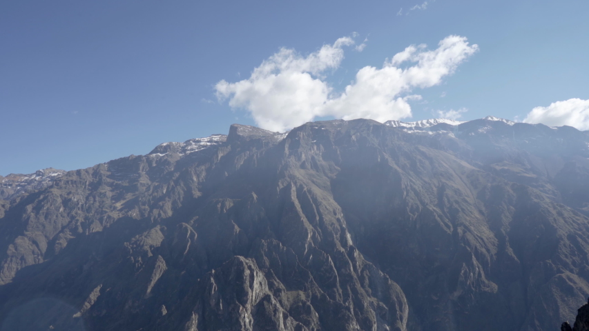 Snow-covered mountain range along the deep Colca Canyon in the Andes near Arequipa, Peru. Scenic View from Mirador Cruz del Condor.