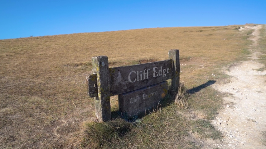 Cliff Edge Sign on the chulk cliffs. Seven Sisters National Park,  Eastbourne, East Sussex, England.