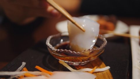 Female Hand Picking Coconut Meat Sashimi. Vegan Food Concept. 4K Footage. 