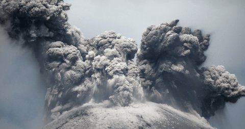 Spectacular volcanic eruption. Huge boulders are thrown from the ash cloud. Reventador volcano erupting in February 2020, situated in a remote part of the Ecuadorian Amazon surrounded by rainforest.