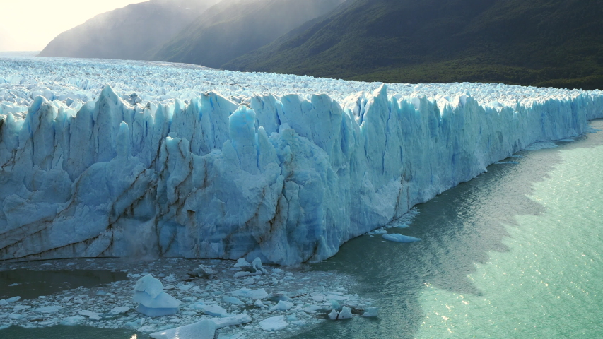 Perito Moreno Glacier in Los Glaciares National Park near El Calafate, Patagonia, Argentina, view of ice chunks collapsing into the water.  Royalty-Free Stock Footage #1046269366