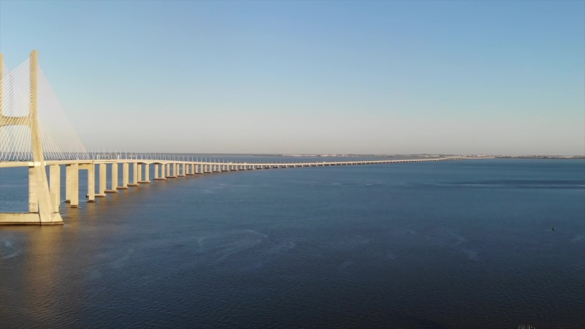 Lisbon / Portugal    , Aerial video from  Vasco da Gama Bridge , Cable  bridge in Portugal   , taken by drone camera from above