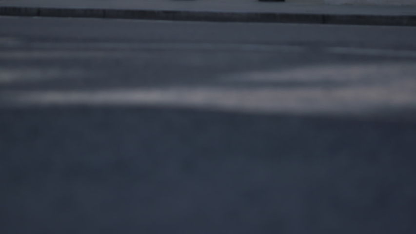 Tilt from the road up to the coat of arms on the wall of the Royal Courts of Justice in London