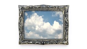 Creative 4k time laps video of moving clouds in a beautiful vintage picture frame. 3D effect of moving image in a static frame.
