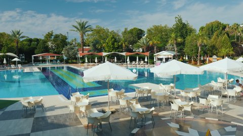 Kemer, Turkey, June 2018: A comfortable hotel with a swimming pool and everything necessary for recreation. Landscaped green area, sun beds and bars