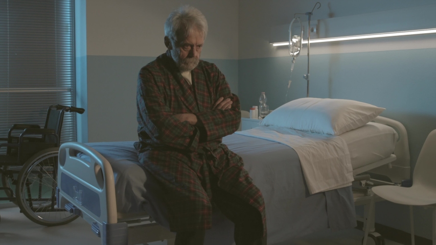 Sleepless senior man sitting on a hospital bed and rocking back and forth, dementia and disease symptoms Royalty-Free Stock Footage #1046306035