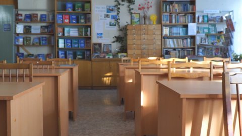 Chapaevsk, Samara region, Russia - January 31, 2020: Panorama of empty tables and chairs in a classroom. Empty class. Soft Selective focus