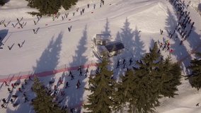 Cross country Ski Race, athlete does cross country skiing along snowy track, Aerial 4K video of Jizera mountains