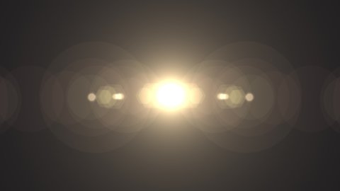 Symmetrical optical lens flares transition that is a seamless loop with natural lighting. 4K 