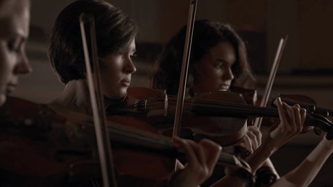 Famous Band of Three Music Players with Classic Wooden Violins. Trio of Attractive Women Playing Acoustic Melody Indoors. Active Pretty Woman as Violinist or Talented Musician with Equipment Close Up
