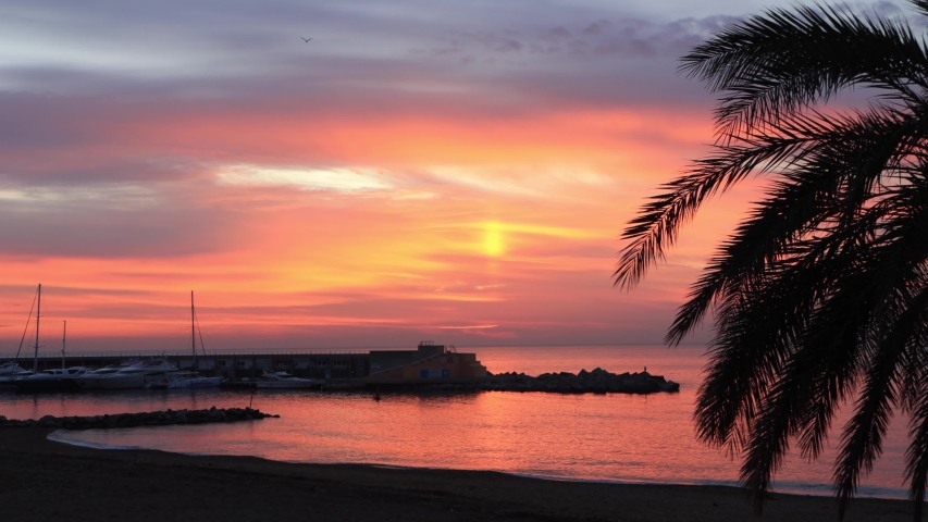 Sunrise over Barceloneta beach in Barcelona, Spain