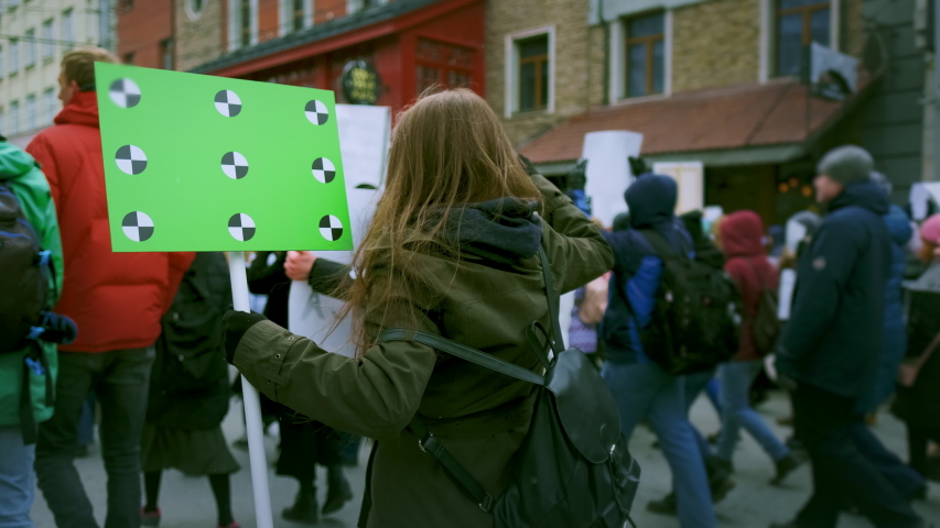 Young adult caucasian female feminist demonstration. Gender right feminism fight. Women march movement power sign equality. Woman strike empowerment action. Crowd people city street public resistance. Royalty-Free Stock Footage #1046339623