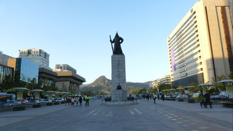 Seoul / South Korea - 11 13 2019: Seoul - South Korea, Circa : timelapse crowded people at Soldier statue in Seoul City ,Korea