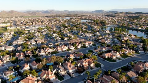 Aerial view of Menifee Lake and neighborhood, residential subdivision vila during sunset. Riverside County, California, United States