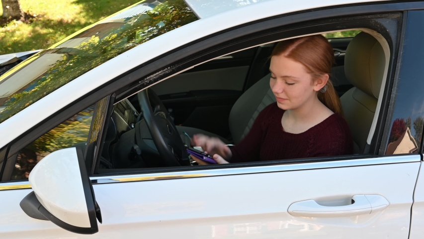 teenager uses a cellphone, notices you, and disregards your look