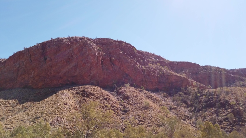Dry Ormiston Gorge with red cliffs in West MacDonnell Ranges in Northern Territory, Central Australia Outback. Ormiston Pound walk is a popular circular walk trekking.