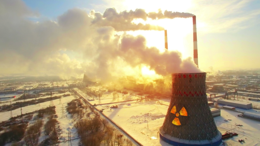 Aerial panoramic flight of hyperlaps around the nuclear power plant. Winter carbon dioxide emissions, Energy of smoke and steam, sun shines through clouds of smoke. Ecology and pollution of nature. Royalty-Free Stock Footage #1046384989