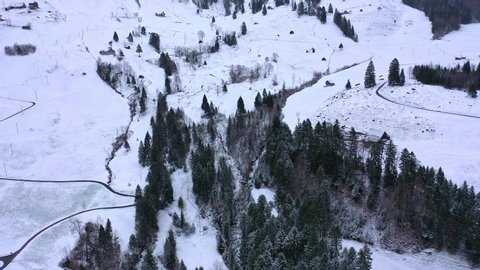 Flight over a snowy mountains in winter - wonderful Swiss Alps - aerial photography