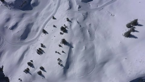 Flight over a snowy mountains in winter - wonderful Swiss Alps - aerial photography