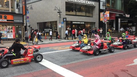Shibuya, Tokyo/Japan - May 2018: The fun and crazy Super Mario Kart Tours outside Shibuya 109 building.