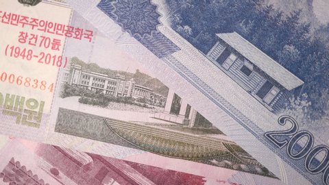 Rotating North Korea Banknotes With Front And Reverse 2002 On Turntable Top View. .