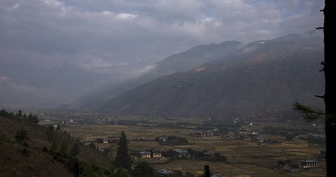 The Thimphu valley at the kingdom of Bhutan, Himalaya. A time lapse video Taken around the Punakha Dzong Monastery in Bhutan. Epic landscape in the early morning shortly after sunrise