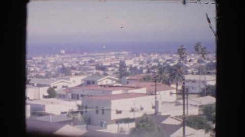 BARSTOW CALIFORNIA USA-1966: Cars Sitting In Front Of Homes Then An Aerial Scan Of City