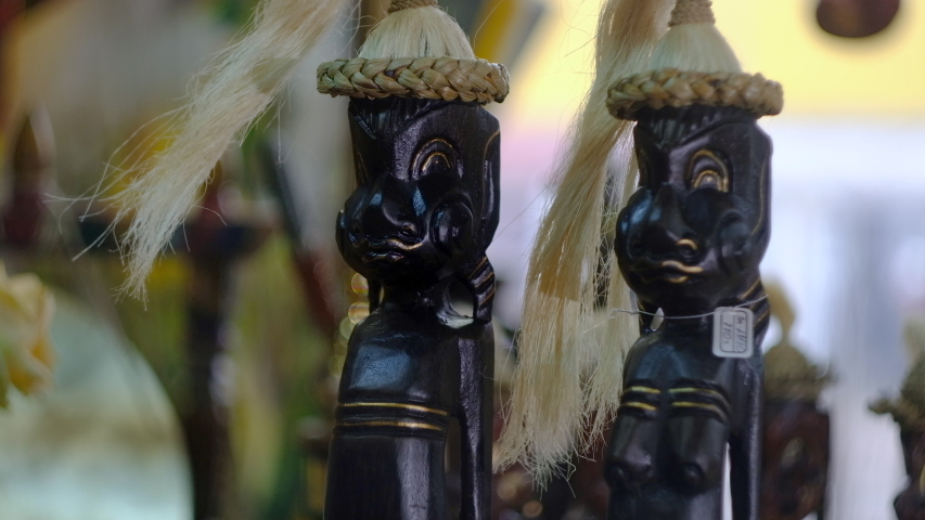 Oriental souvenirs in the store, hippos from wood, turtles, fish from expensive wood