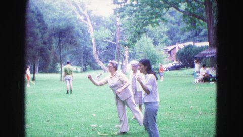 GALENA ILLINOIS USA-1967: Group Of People In A Park Playing Lawn Darts On A Sunny Day