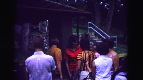GALENA ILLINOIS USA-1967: A Scene Of A Group Of People Outside Talking Together