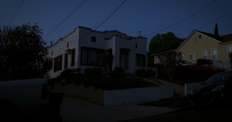 An upscale neighborhood establisher, multiple exteriors shot with a locked off angle at night. Affluent neighborhood with palms trees in Los Angeles or San Diego California. Native 10bit 422 prores 